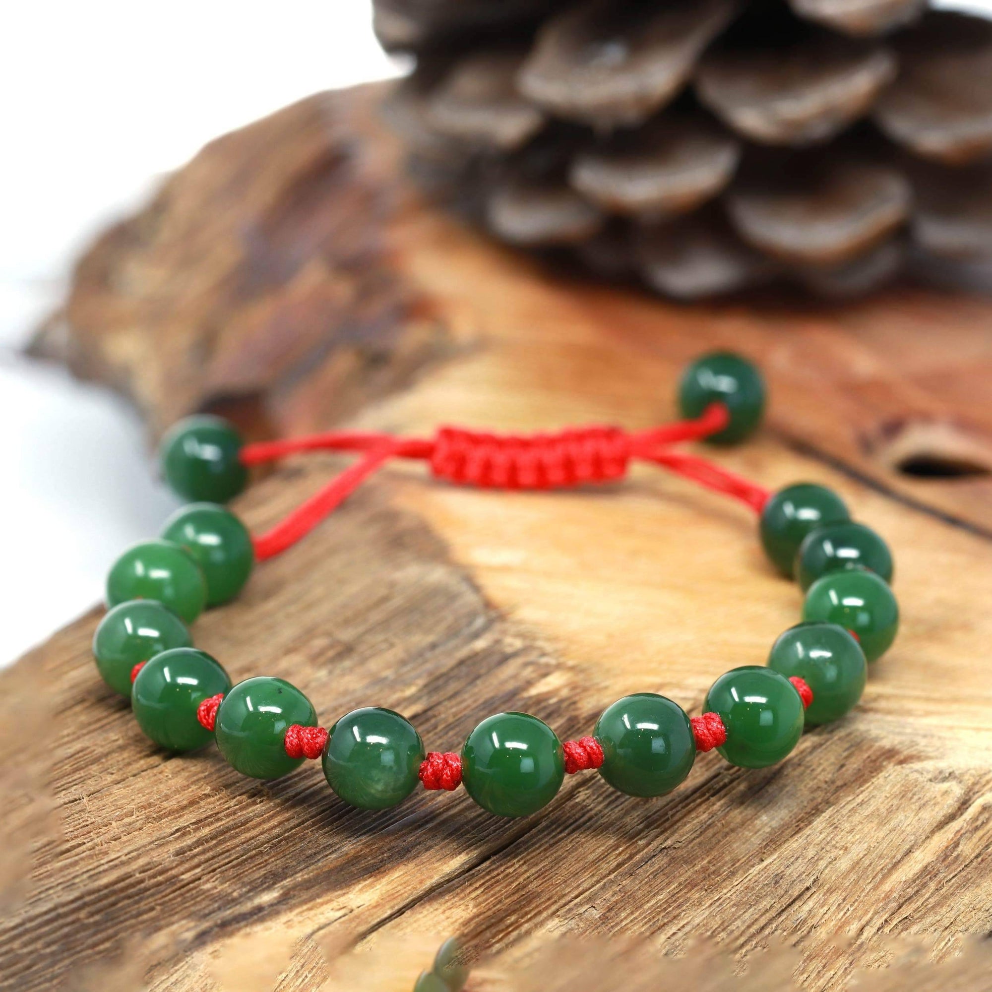 Baikalla 5 in Baikalla Natural Nephrite Jade Bead Bracelet With Red String